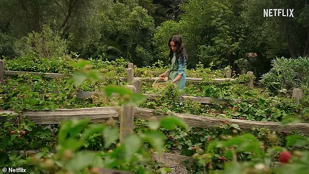 In one scene, Meghan walks through her garden and picks fresh fruit, while wearing a denim jumpsuit