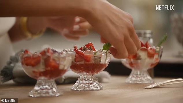 Meghan prepares a dessert that bears a resemblance to Eton Mess, containing strawberries, cream, mint and a berry coulis