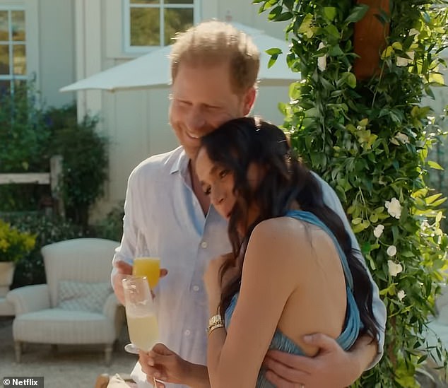 The clip shows Prince Harry and Meghan Markle sharing a sweet moment while each enjoying a drink