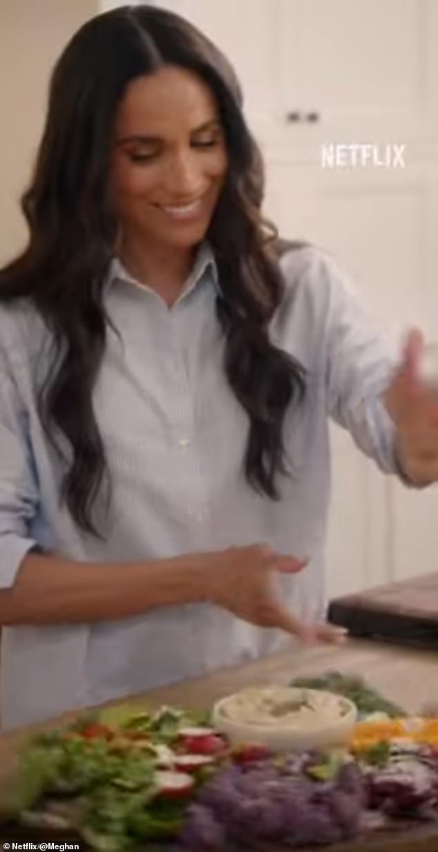 Meghan, 43, is pictured in her Montecito kitchen cooking during the trailer, for the series which will land on Netflix on January 15