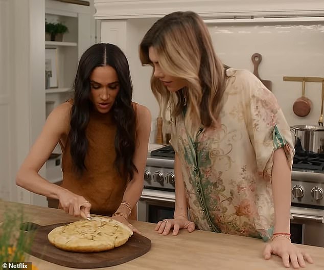 Meghan is shown baking a focaccia alongside a friend in the trailer for the new series