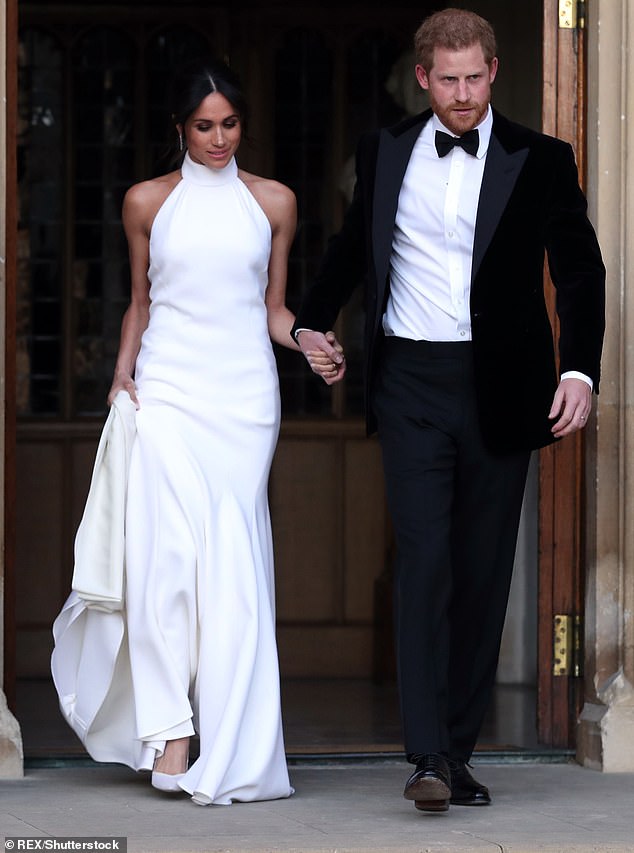 Changing into a halter neck frock by Stella McCartney for her wedding reception, Meghan teamed it with a pair of £700 bespoke Aquazzura heels that featured a pale blue bridal sole to complement her evening ensemble