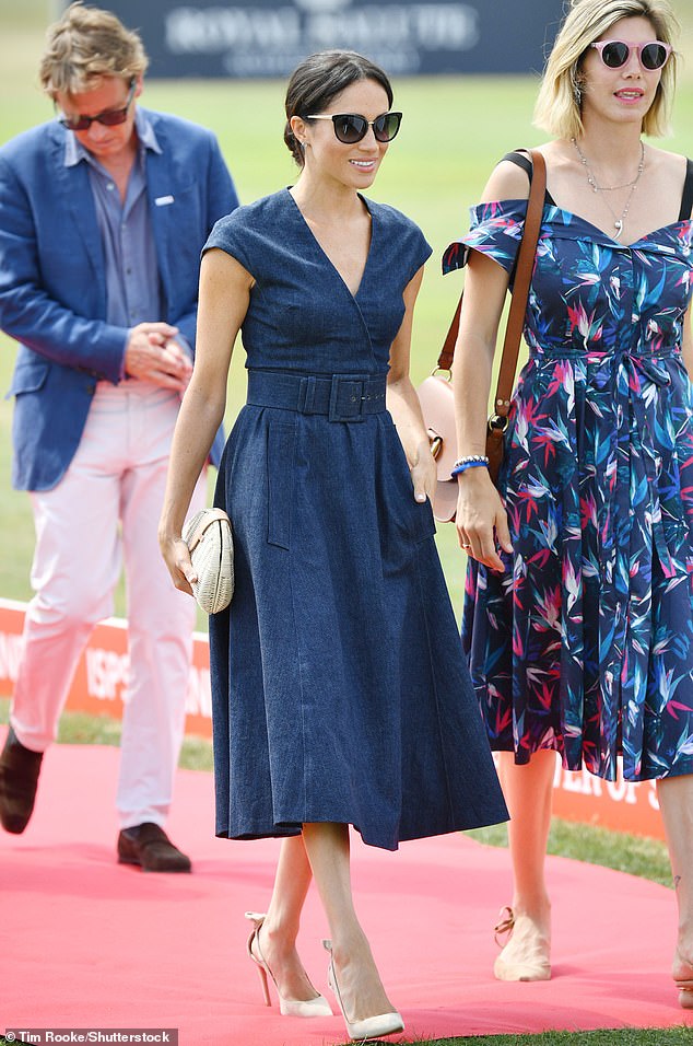 Meghan added some glamour to her Carolina Herrera denim dress at the polo in 2018 with her £645 pink suede Deneuve pumps