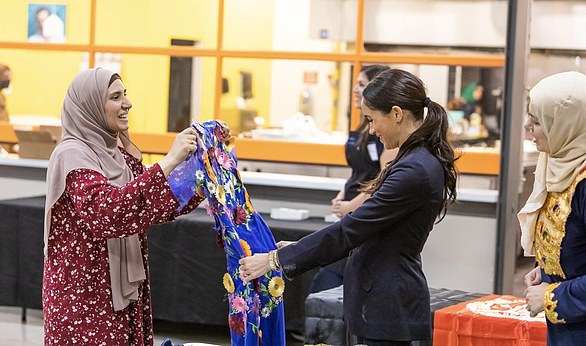 Meghan Markle engages with one of the women at The Archewell Foundation¿s San Antonio Welcome Project during a visit on Friday