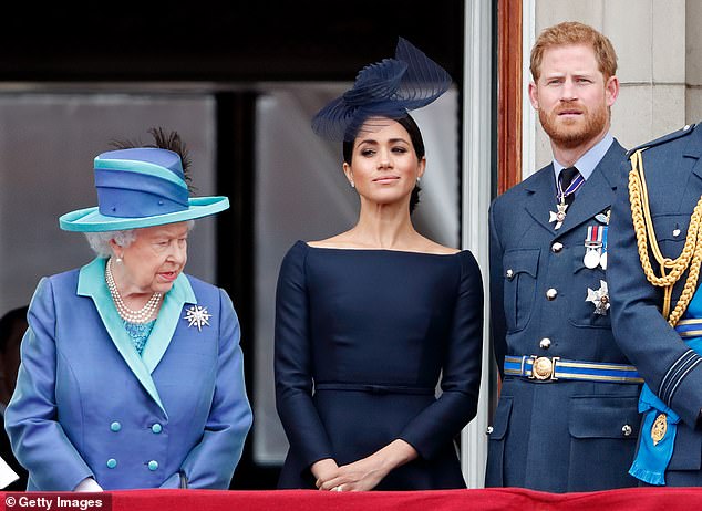 The late Queen Elizabeth with Harry and Meghan on Buckingham Palace's balcony in 2018