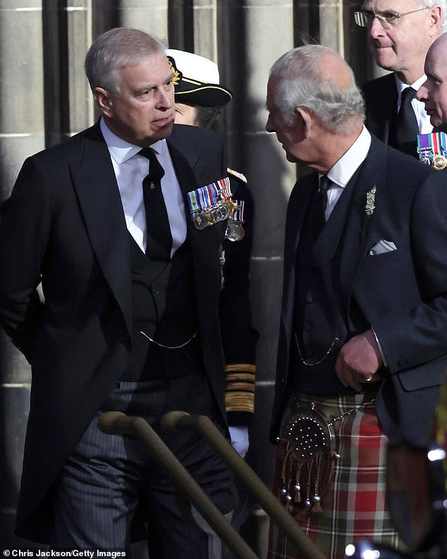 Prince Andrew and King Charles III talk as they depart St Giles Cathedral after a Vigil in memory of Queen Elizabeth II on September 12, 2022, in Edinburgh