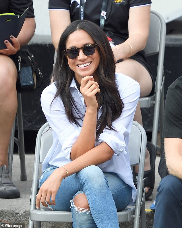 For her first public appearance with Harry in 2017, Meghan famously wore Misha Nonoo's oversized white button-down called 'The Husband' shirt