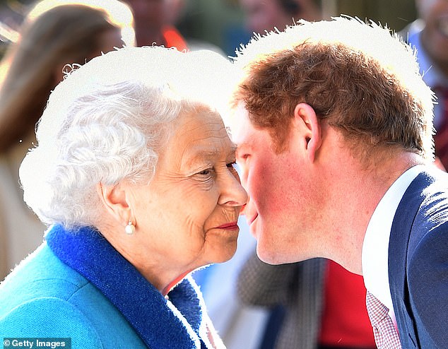 Queen Elizabeth II and Prince Harry share a kiss at the Chelsea Flower Show on May 18, 2015