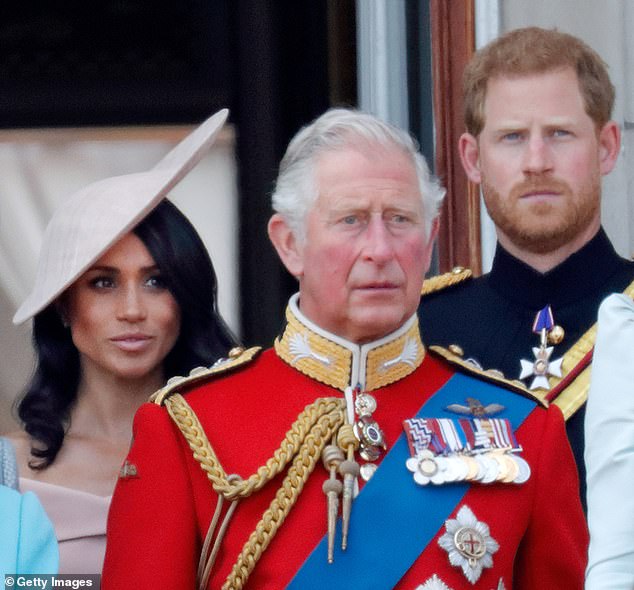 Meghan, Harry and Charles stand on the balcony of Buckingham Palace during Trooping The Colour 2018