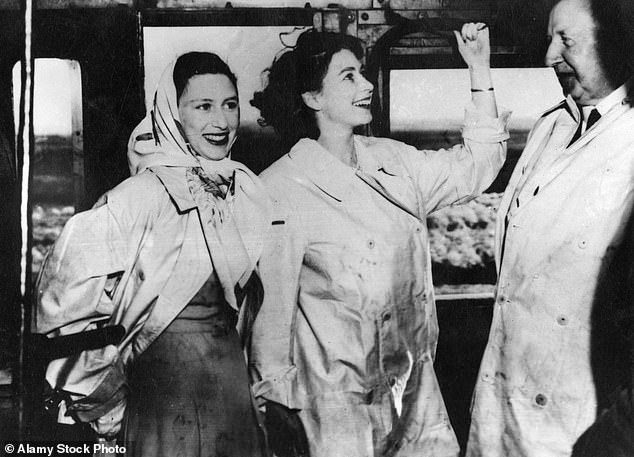 Elizabeth and Margaret smiling on the Royal Train during the royal tour of South Africa in 1947