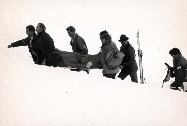 Ski tragedy: Prince Charles and rescuers carry a stretcher after the Klosters avalanche in 1988