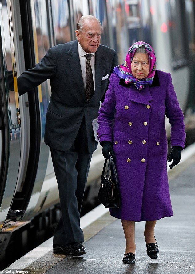 Queen Elizabeth II and Prince Philip, Duke of Edinburgh arrive at King's Lynn station near Sandringham, after taking the train from London King's Cross on December 21, 2017