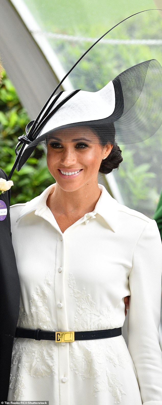 During her debut at Royal Ascot, Meghan beamed in a monochrome ensemble by Givenchy with Philip Treacy's Wave hat