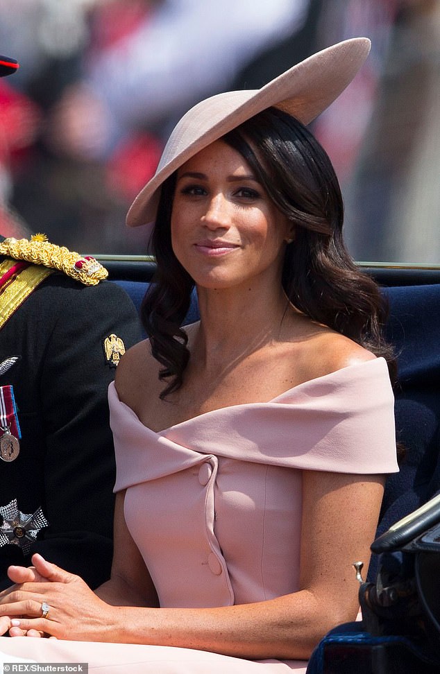 At her first Trooping the Colour, Meghan embraced a ladylike charm with a blush pink off-shoulder dress by Carolina Herrera and coordinating Philip Treacy slice hat