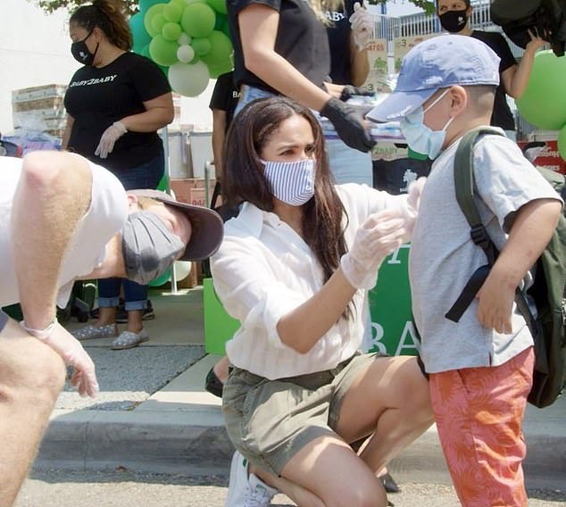 Pictured: the Duke and Duchess of Sussex volunteering for Kelly Sawyer Patricof's charity Baby2Baby in 2020