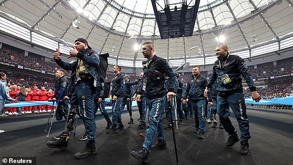 Ukrainian athletes take part in the parade during the opening ceremony of the Invictus Games, founded by Britain's Prince Harry, at BC Place stadium in Vancouver, British Columbia, Canada February 8, 2025.  REUTERS/Chris Helgren