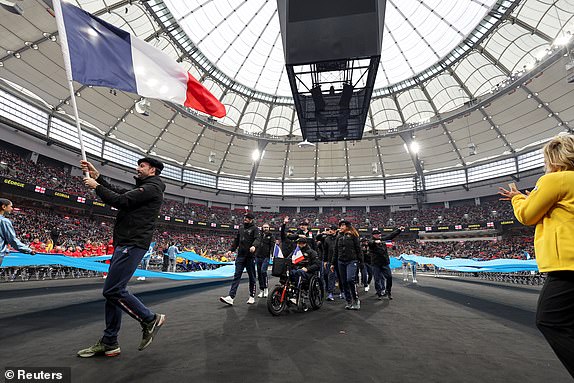 French athletes take part in the parade during the opening ceremony of the Invictus Games, founded by Britain's Prince Harry, at BC Place stadium in Vancouver, British Columbia, Canada February 8, 2025.  REUTERS/Chris Helgren