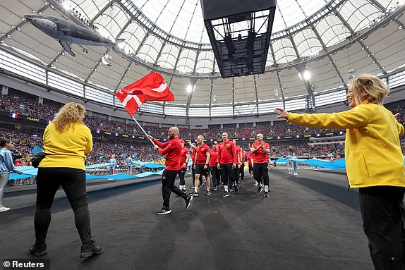 Danish athletes take part in the parade during the opening ceremony of the Invictus Games, founded by Britain's Prince Harry, at BC Place stadium in Vancouver, British Columbia, Canada February 8, 2025.  REUTERS/Chris Helgren