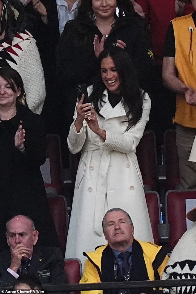 Meghan Markle took the opportunity to whip her phone out during the ceremony to capture the crowd