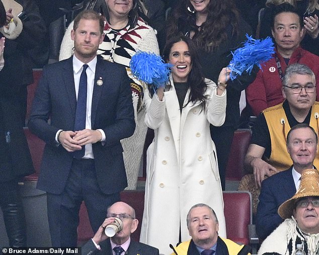 The former Suits actress was beaming as she raised her blue pom-poms in the air