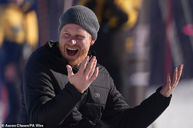 A laughing Harry (pictured) is thought to then shout 'feet up, feet up, feet up', as he watches his wife hurtle towards the bottom of the snowy hill