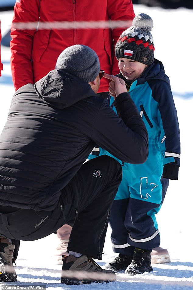 The Duke of Sussex meets a child on the way to the Skeleton Finals, during the 2025 Invictus Games in Whistler, Canada