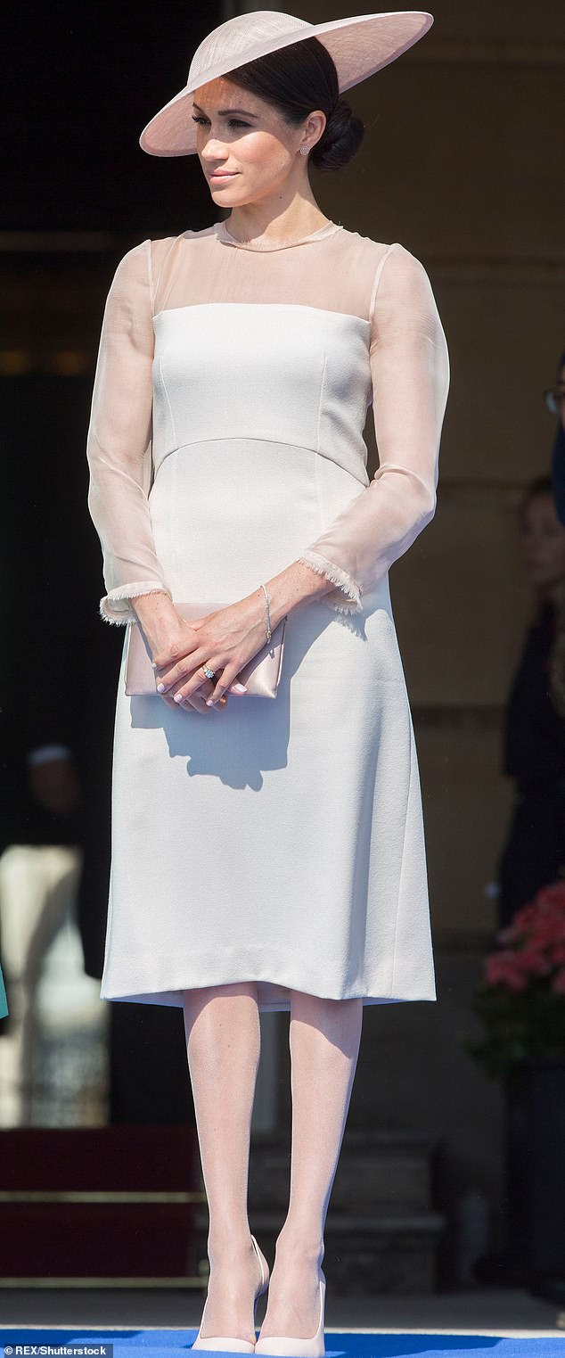 Who can forget Meghan's awkward debut at a Buckingham Palace garden party? She went full on 'repli-Kate' in a rose pink below the knee dress, Philip Treacy hat, satin clutch and (shock!) sheer panty-hose that shimmered in the May afternoon sun (pictured).