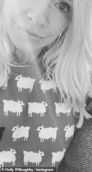 Holly takes a selfie in a similar jumper in December 2020