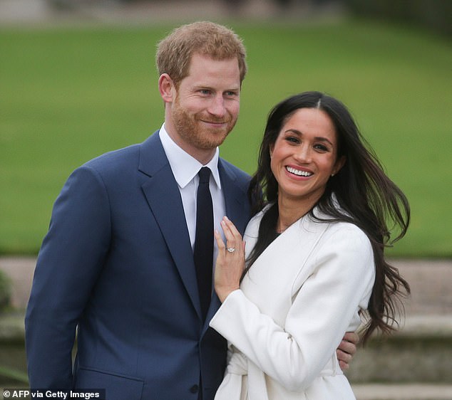 Harry and Meghan pose after announcing their engagement in November 2020