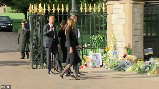 Unearthed footage seems to show Harry having to pull his wife back with his arm so that she didn't pull ahead of his older brother