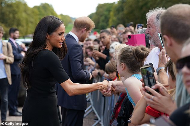 Meghan and Harry chat to mourners outside Windsor after the Queen's death