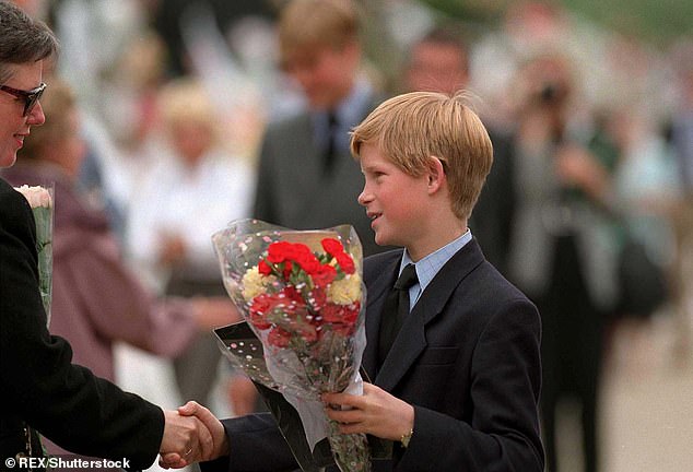 A 12-year-old Prince Harry greets royal fans outside Kensington Palace