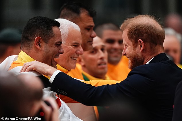 Harry smiles during the medal presentation after the sitting volleyball final in Vancouver