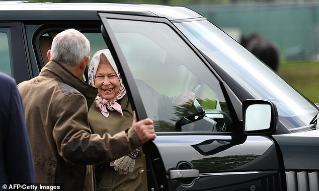 The late Queen Elizabeth has the door of her Range Rover held open for her as she attends the Royal Windsor Horse Show in May 2019