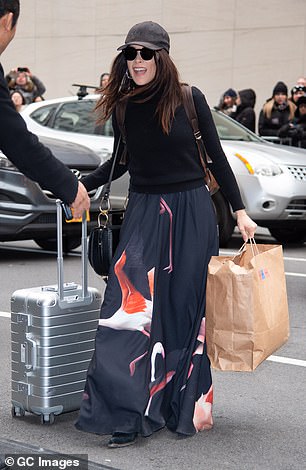 Meghan's Suits co-star and friend Abigail Spencer came to the shower with a suitcase and gift bag