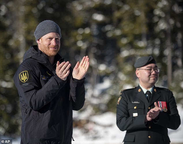 The Prince applauds during the awards ceremony for the biathlon