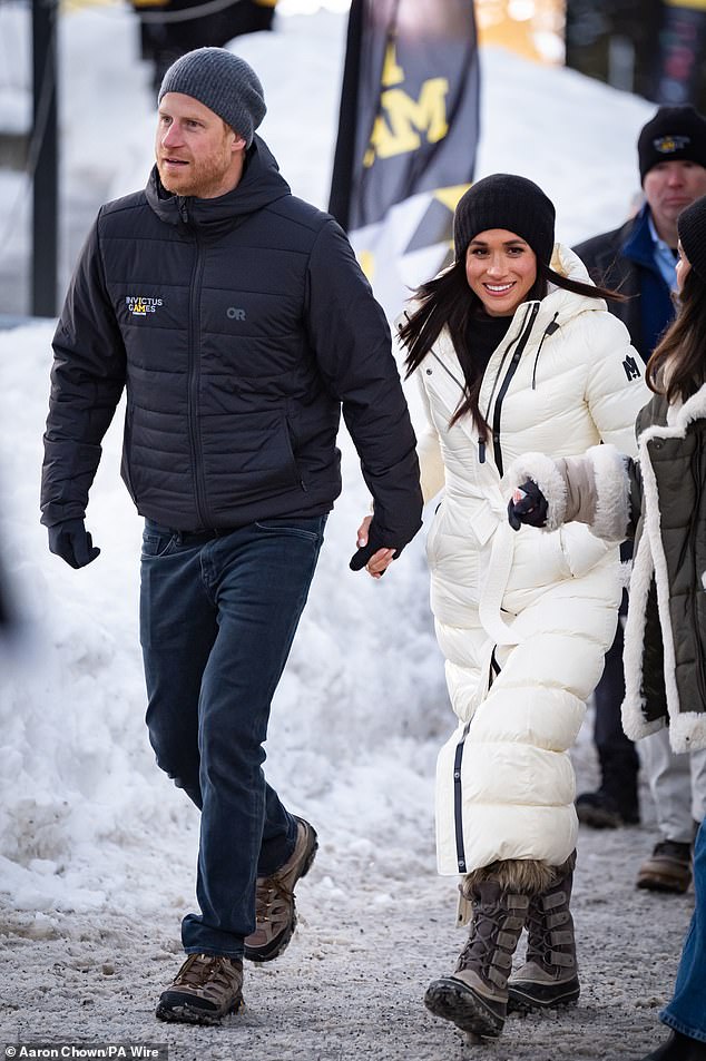 With Meghan now back in California, Harry is said to be taking the day to enjoy the up-market resort at his own pace. Pictured: Harry and Megan walk hand in hand at the Hillcrest Recreation Centre at the Invictus Games on February 10