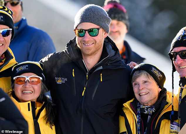 Harry was all smiles as he posed for pictures with athletes while attending the  Biathlon event during day three of the Invictus Games on February 11.