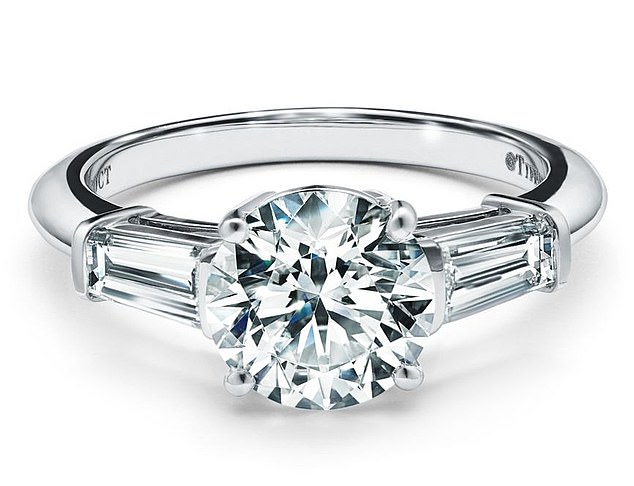 This £5,000 Tiffany ring features two tapered baguette diamonds precisely cut to frame a classic round brilliant centre stone