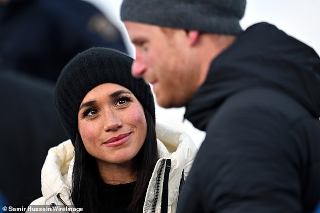 Meghan looks longingly into Prince Harry's eyes as the pair go for a walkabout in Whistler