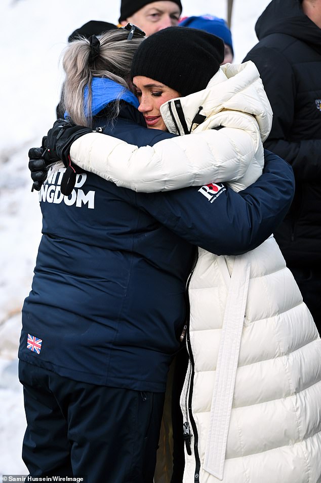 Meghan hugs a member of Team UK at the Skeleton Finals during day two of the 2025 Invictus Games