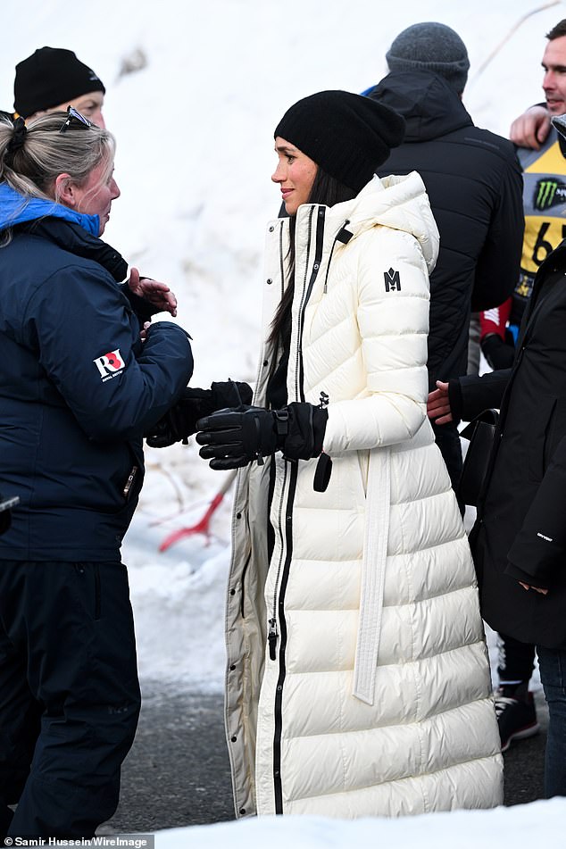 Wrapped up against temperatures of -11 they chatted with the competitors and their families by the side of the track