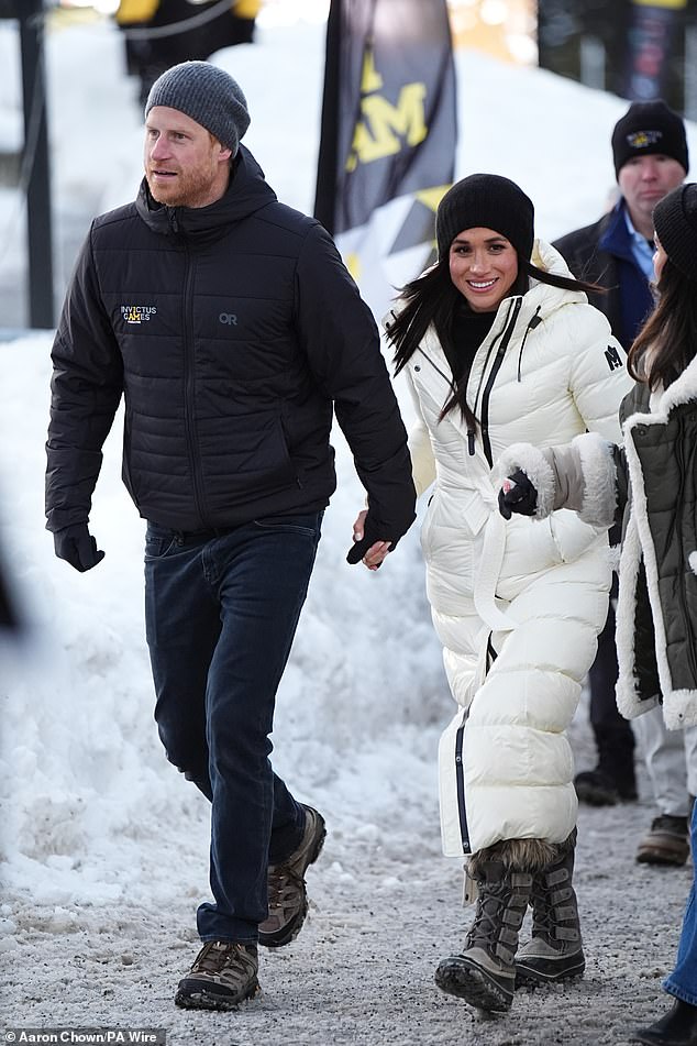 Meghan wore a £1,000 white Mackage coat, Hattack Beanie and Sorrel boots during her walkabout in Whistler