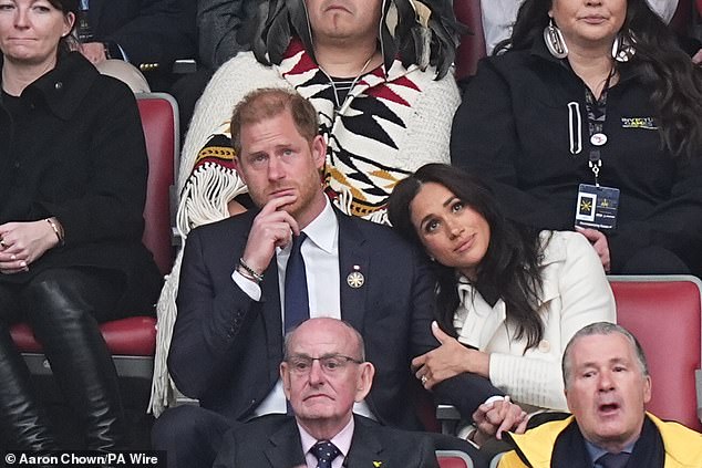 Meghan puts on a loved-up display with her husband at the Invictus Games opening ceremony