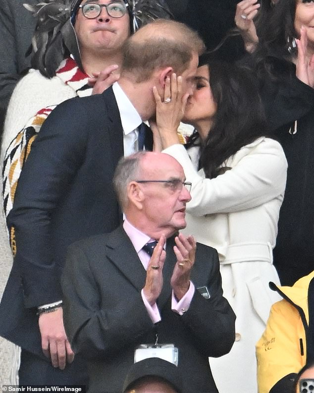 Duke and Duchess of Sussex kiss during the opening ceremony of the 2025 Invictus Games