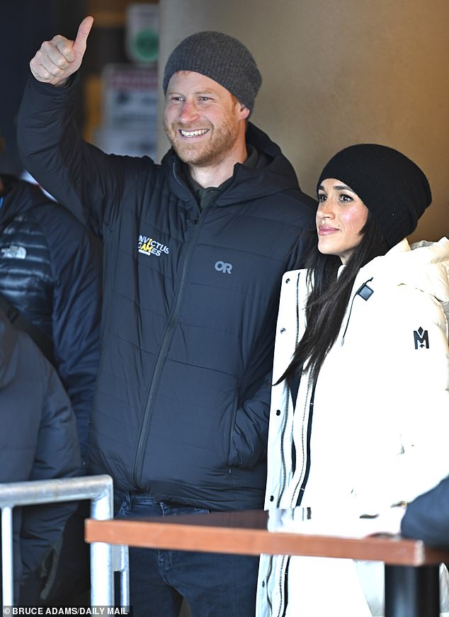 Prince Harry gives the thumbs up as he and Meghan Markle attended the Whistler welcome party