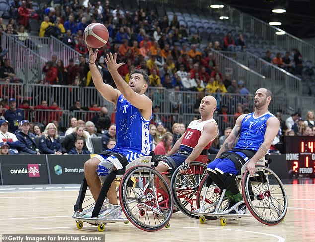 Pictured: Athletes during the gold medal wheelchair basketball match on Sunday