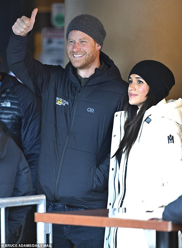 Prince Harry gives the thumbs up as he and Meghan Markle attended the Whistler welcome party