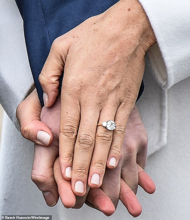 Prince Harry proposed to Meghan in 2017 with a cushion-cut diamond, estimated to be between 2.5 and 3 carats, that he had sourced from Botswana - where the couple took their first holiday together (pictured in November, 2017)