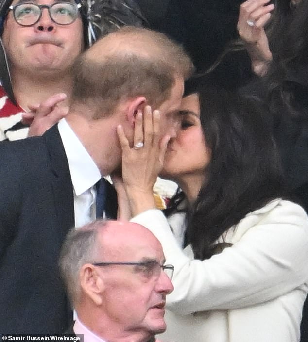 The Duchess of Sussex was seen smooching her husband